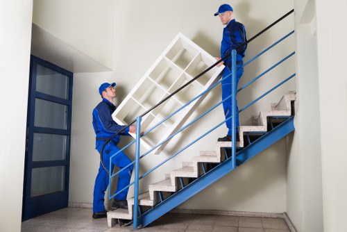 Professional movers handling furniture for a local Wealdstone house move