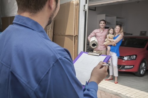 House removal crew handling furniture and boxes during a local move