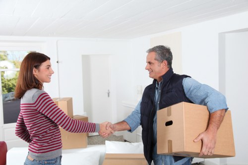 Furniture and household items being loaded into a moving van