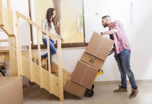 Careful unpacking of household boxes in a new Wealdstone property