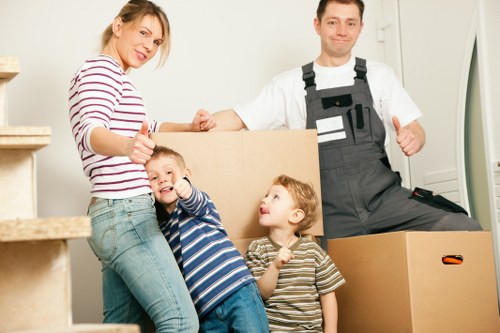 Professional movers navigating a Wealdstone property access challenge